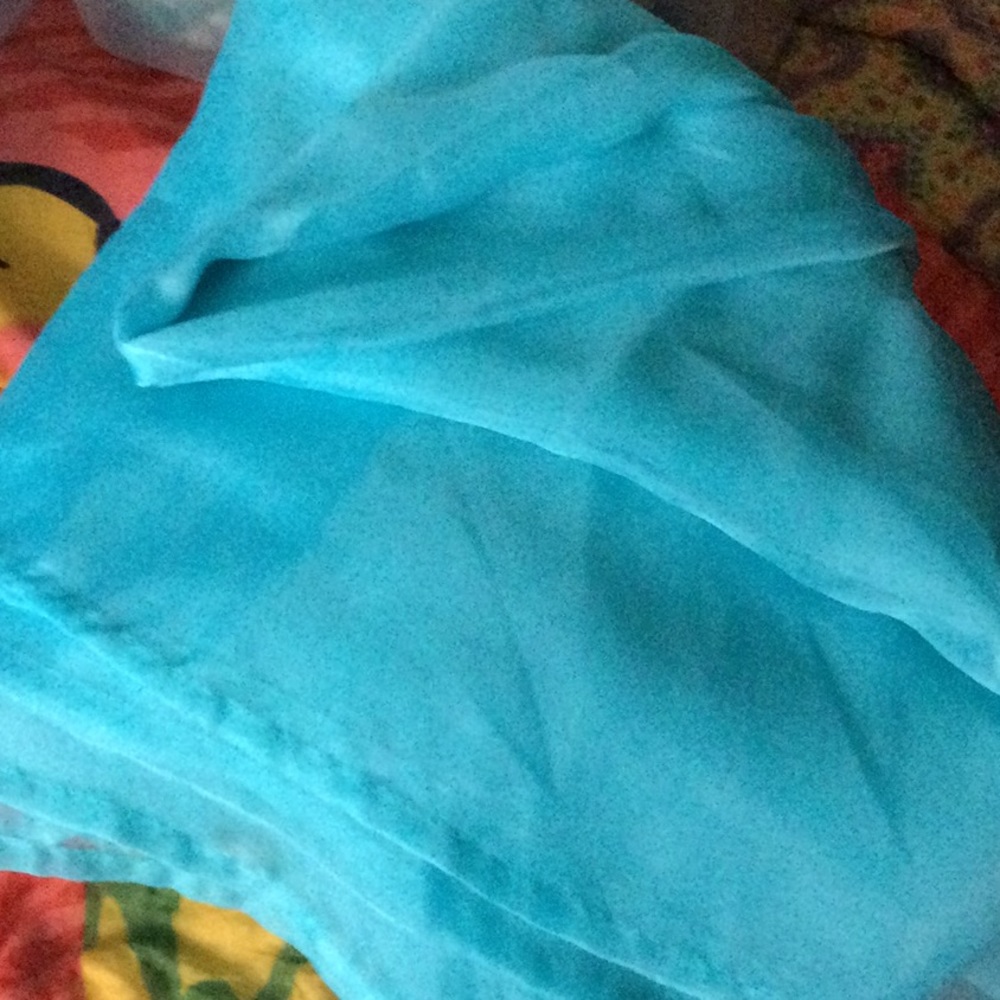 Turquoise sheer curtains with scarf valance
